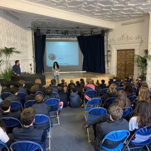 A journalist talking to the class of students